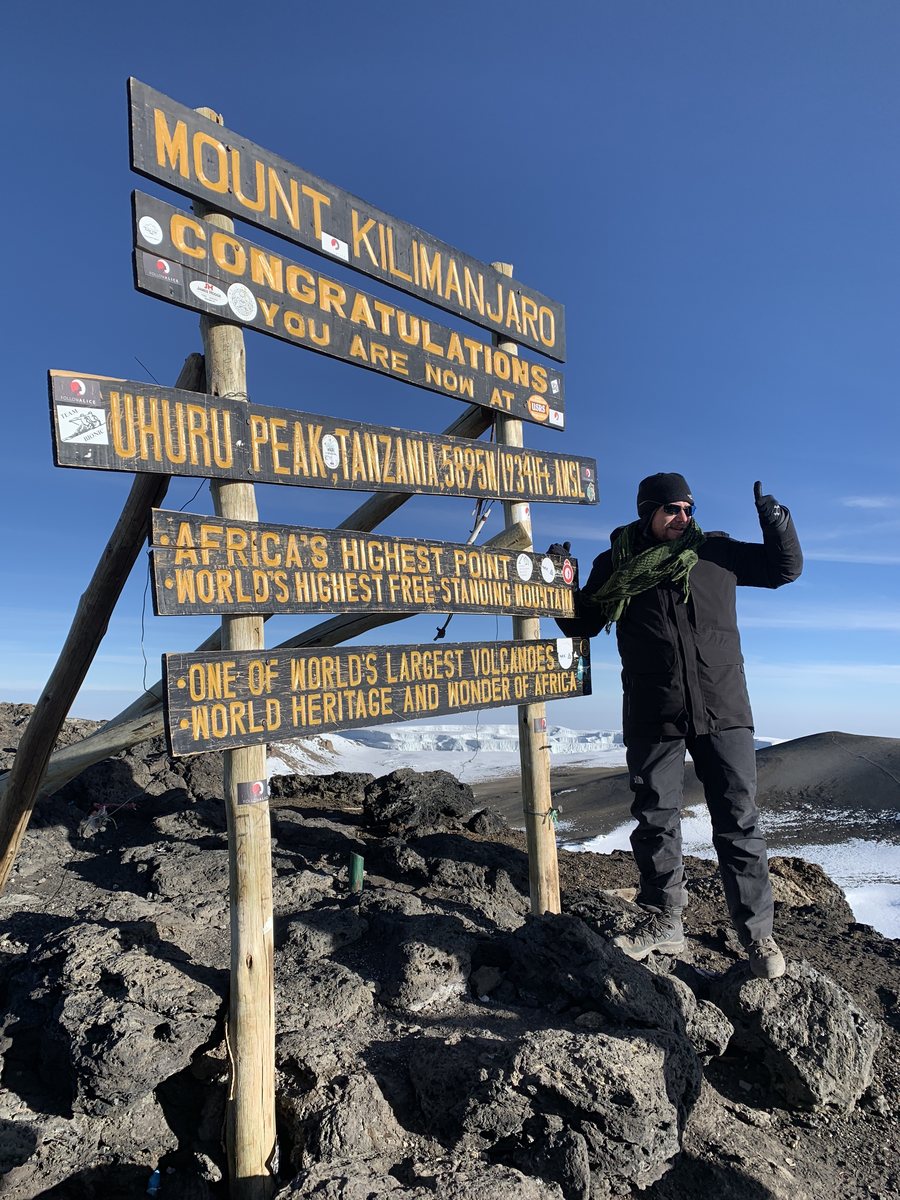 Joshua Bush at the summit of Mount Kilimanjaro, October 2018